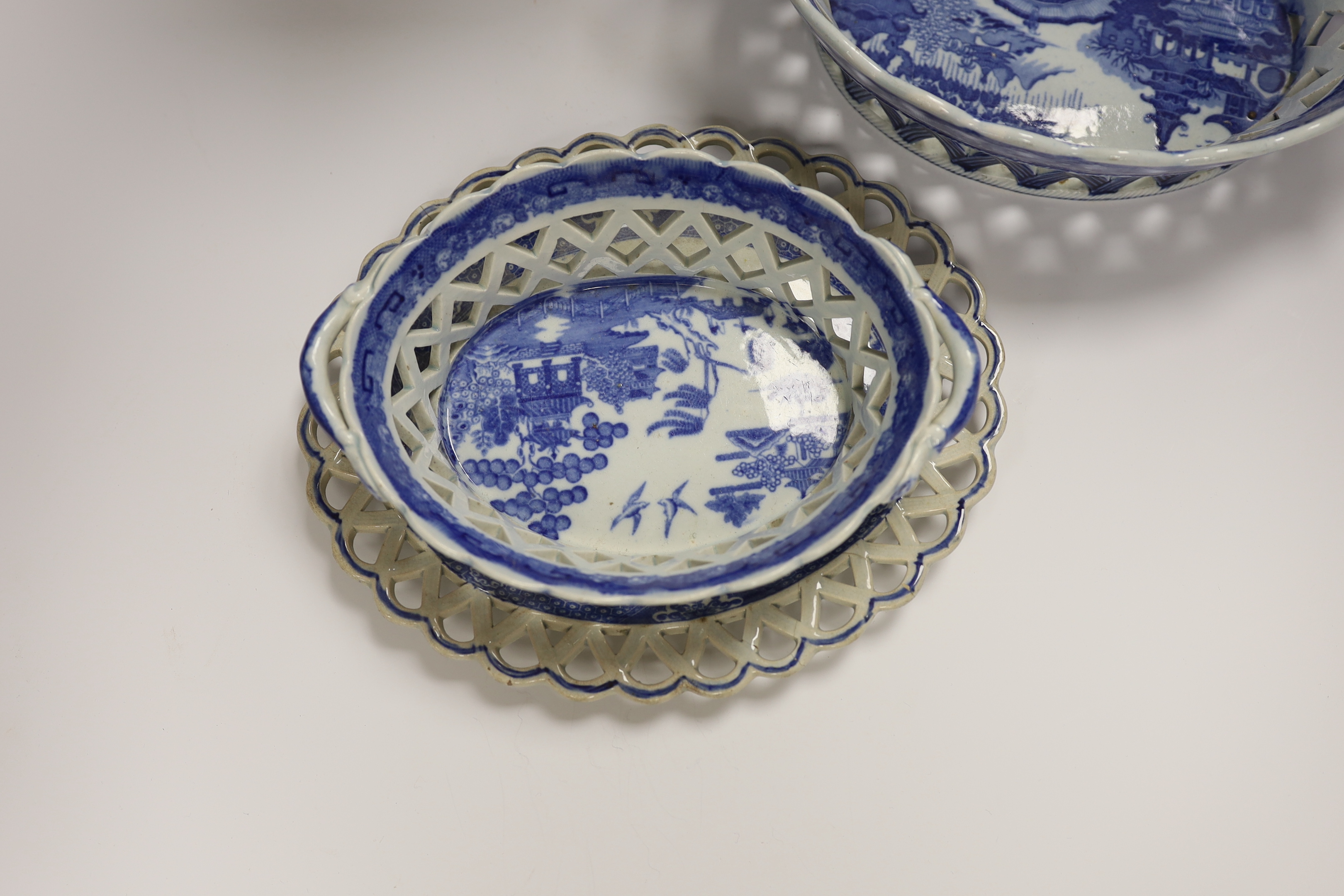 An 18th century hexagonal Delft vase, two pearlware blue and white baskets and a similar dish, tallest 27cm